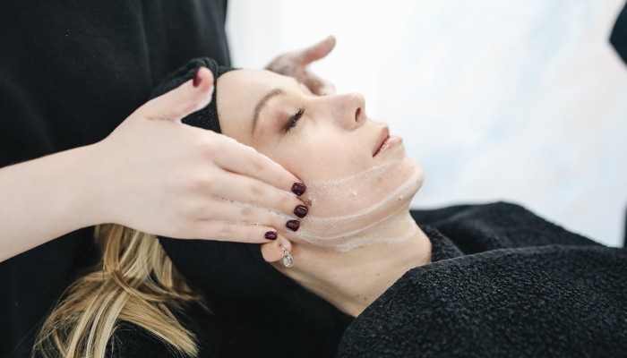 skincare woman receiving facial skin treatment